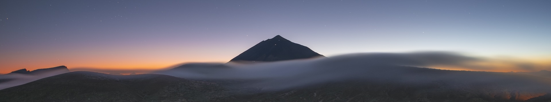 Teide at night over a cinematic horizon